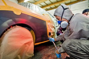 Spot repair painting technique on a practice vehicle